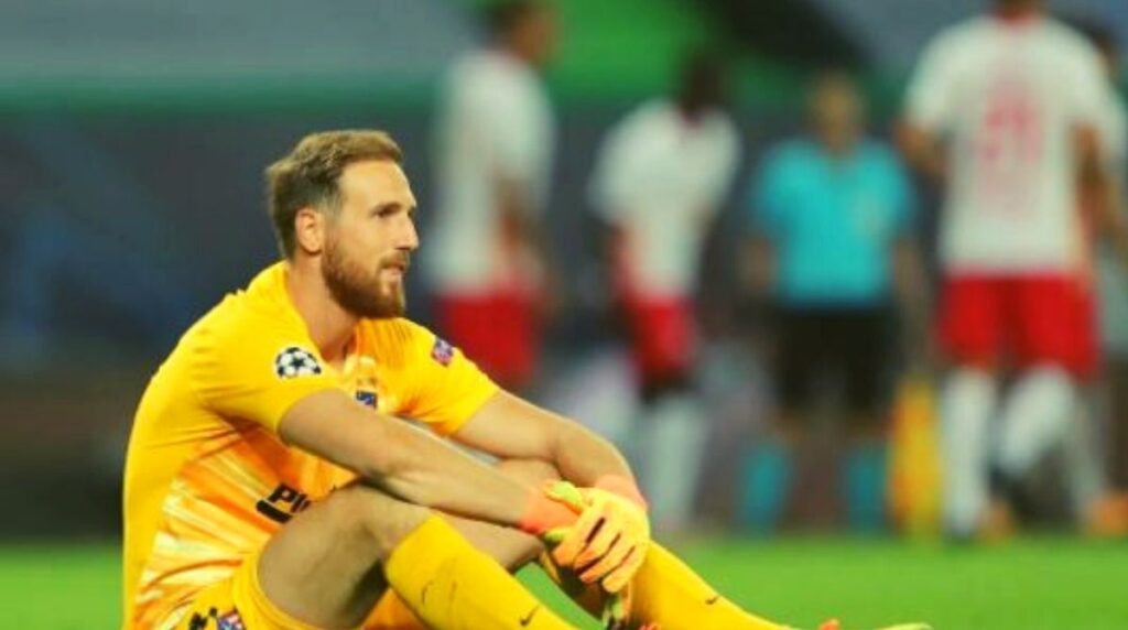 A player is sit in a football ground